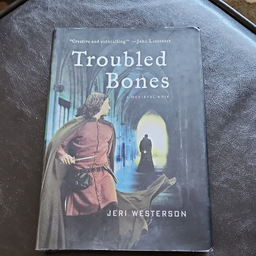 Troubled Bones Hardcover Book